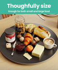 31.5 Inch Lazy Susan Turntable With 360 Degree Rotation Sintered Stone Silent Anti Slip Surface displayed on a table with food items