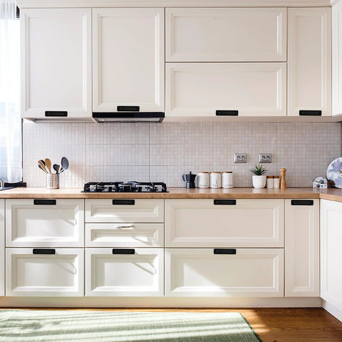Stylish white kitchen with Four Pack Stick On Cabinet Handles No Drill Drawer Pulls Adhesive Door Handles installed on cabinets.