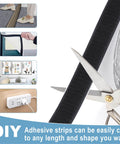Heavy Duty Adhesive Strips Roll 26.5 Feet By 1.2 Inches Self Adhesive Nylon Back Fastener Tape being cut for DIY projects