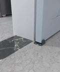 Black aluminum floor guide for sliding barn doors and bypass systems in a modern interior setting