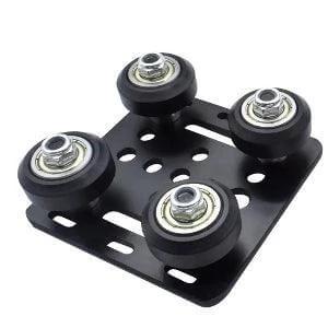Black anodized aluminum bearing guide plate for 1000mm V-slot gantry, part of an extrusion 2020 support system.