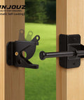 Self Locking Gate Latch on wooden fence with black finish, automatic gravity lock for outdoor use on wooden and metal gates