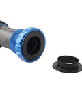 Two Pack Black Axle Protection Covers for Bike Bearings showing cover detached from blue bike axle.