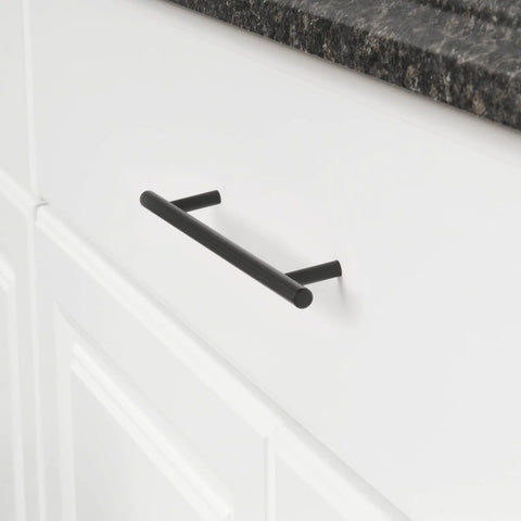 Euro Bar Cabinet Pull Handle Flat Black Finish Three Eighths Inch Diameter Eight Point Six Nine Inch Length Center To Center Six Point Three One Inch With Mounting Hardware Included Ten Pack installed on white drawer