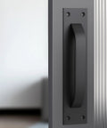 2 Pack Black Matte Finish Barn Door And Cabinet Pull Handles Heavy Duty Door Hardware installed on a modern cabinet door