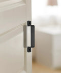 Sliding Barn Door Handles Set In Black 7.4 Inch mounted on white interior door showing side view