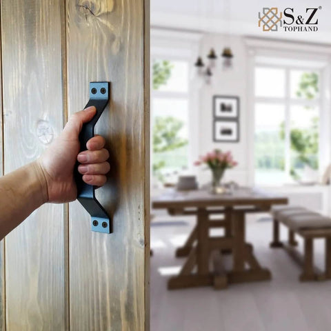 Person holding 9 Inch Sliding Barn Door Handle Set In Black For Interior And Exterior Doors on wooden door, showcasing installation.