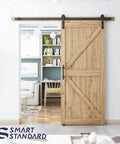 6.8 ft heavy duty sliding barn door hardware kit in black installed, showing wood door on aluminum alloy track in living room