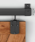 Close-up of a 5-foot Black Exterior Sliding Barn Door Hardware Track Kit Heavy Duty Outdoor Weatherproof Wall Mount System Supports Up To 500 Lbs