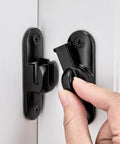 Close-up of Black Barn Door Latches,90/180 Degree Gate Lock,Flip Gate Latches Hardware in use on a white cabinet door.