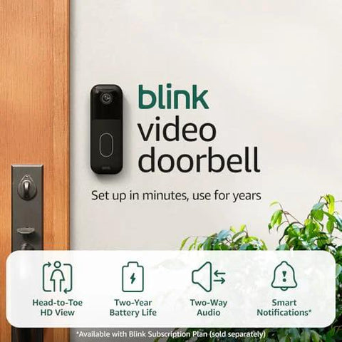 Video Doorbell Latest Model With Head To Toe HD View With Night Vision Two Year Battery Life Easy Setup displayed on wall near door