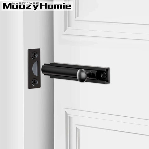 3 Inch Solid Brass Surface Bolt Beefy Built Heavy Duty Concealed Sliding Door Bolt Latch installed on white door, black finish