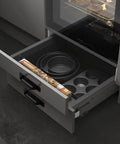 Open kitchen drawer with 12 Pack 5 Inch Matte Black Square Cabinet Handles With Base Plate Aluminum Drawer Pulls And Sliding Door Pulls For Cabinets And Furniture Includes 24 Screws And Easy Drill Punch Free Installation shown in modern setting.
