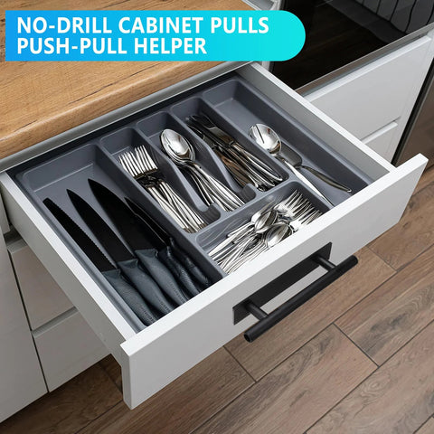 Black self-adhesive cabinet pull on white kitchen drawer with utensils, part of Self-Adhesive Cabinet Pulls 30 Pack For Kitchen Cabinets And Furniture ABS Plastic Peel And Stick Door Handles Black Push Pull Drawer Pulls For Cabinets And Sliding Doors Easy Installation And Durable Adhesive.