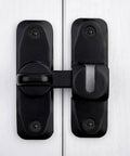 Barn Door Latches,Black 90/180 Degree Gate Lock, close-up of zinc alloy right angle door lock latch on white wooden door.