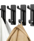 Adhesive Wall Hook 4 Pack Heavy Duty Holds Up To 13 Pounds With Double Hook Design Peel And Stick Mount No Drilling For Coats Towels In Bathrooms Bedrooms Kitchens RVs And Entryways Black installed on wall holding towels