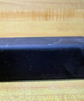 Side view of black EPDM block with 50 Shore A hardness, compatible with Built Tough Industrial Grade 1.5 Inch Chain Pitch Gripper Chain.