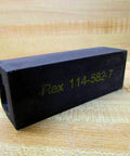 Black rectangular component labeled 'Rex 114-582-7', potentially part of a Built Tough Industrial Grade 1.5 Inch Chain Pitch Gripper Chain.