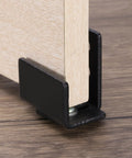 Close-up of Bottom Floor Guide For Barn Doors Adjustable U Bracket Flush Design Flat Swing Stopper Carbon Steel, black