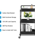 Front view of Foldable 3 Tier Metal Utility Rolling Cart With Locking Folding Design For Easy Storage And Mobility The Workhorse Trolley Organizer For Home Office Library Black with books and decor