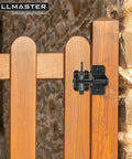 Self Locking Gravity Gate Latch for wood fences and metal gates, black powder coat finish, installed on a wooden gate
