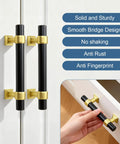 10 Pack 3 Inch Black And Gold Cabinet Pulls For Kitchen Cupboards, Bathrooms And Dressers, shown installed on white doors.