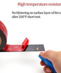 Test of the Double Sided Heavy Duty Mounting Tape For Indoor Outdoor Use, flame resisting surface with a lighter, red and black tape.