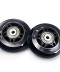 Two black wheels from 8 Pack 64mm 82A Indoor Inline Skate Replacement Wheels with ABEC-7 Bearings, Indoor Skating Wheels, Luggage Wheels