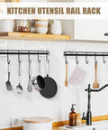 Kitchen Utensil Hanger, Adhesive Utensil Holder Wall Mount Kitchen Rack Rail with 12 Hooks, Space Saving and No Drilling, Black, 2 Pcs, installed on white tile wall with utensils.