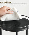 Cleaning the top of Three Tier Lazy Susan Organizer With 360 Degree Rotation Ball Bearing Turntable Spice Rack in Black with cloth