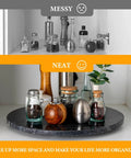 16 inch black marble lazy susan for kitchen use, natural stone rotating serving and organizer tray with organized kitchen items.