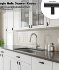 Bulk 50 Pack 2 Inch Black Matte T Bar Cabinet Knobs with 1 Inch Screws Included installed on modern kitchen cabinets.