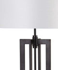 Close-up of the Tanya Tower Floor Lamp By Safavieh, Modern Farmhouse Rustic Industrial Black 59-Inch Standing Lamp base and shade.