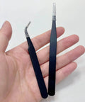 Close-up of black Punching Needle Wick Insertion Tools from All In One Candle Making Kit For DIY Fans in hand