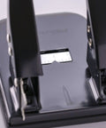 Close-up of black Two Hole Paper Punch 30 Sheet Capacity Black For Office And School With Adjustable Guide And Easy Chip Tray