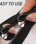 Close-up of installing a Six Piece Metal Zipper Pull Replacement Set For Luggage Suitcases Backpacks Jackets Purses And Handbags Clip On.