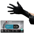 Black Nitrile Exam Gloves 4.3 Mil Medium Textured For Grip Auto Tattoo Catering being worn with product box shown