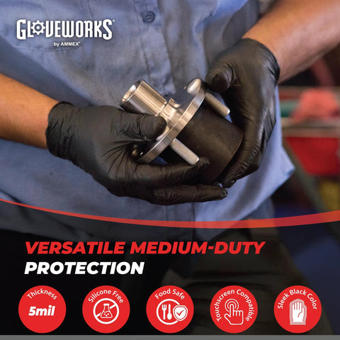 Person wearing Black Nitrile Gloves 5 Mil Silicone Free for Food Prep and Cleaning, Disposable, holding metal part