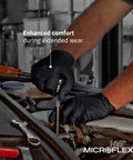 Mechanic wearing Black Nitrile Exam Gloves 4.3 Mil Medium Textured for grip while working on a car engine