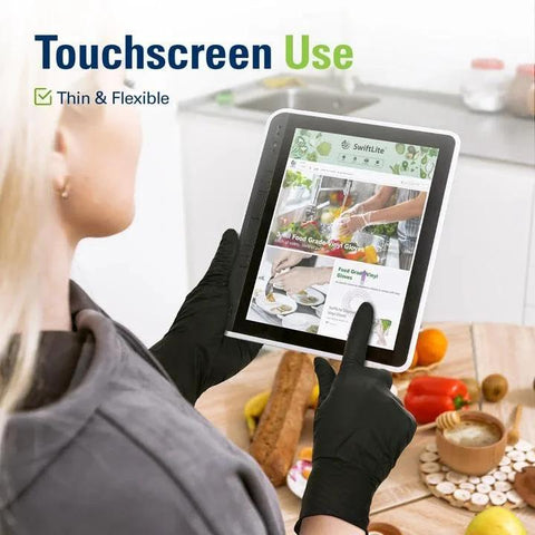 Person using tablet with Black Nitrile Gloves Disposable Latex Free Powder Free Food Safe For Cooking in kitchen