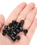 Hand holding 100pcs Nylon Round Spacers 4mm ID, 7mm OD, 6mm Height Screws Spacers Without Threaded, Plastic Spacer for M4 Screws, Black