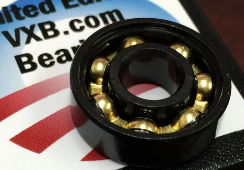 Close-up of 8-Pack Skateboard Black Open Bearings - Bronze Cage 8x22x7mm showing bronze balls inside black casing.