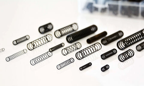 114 Piece Black Oxide Finish Compression Spring Assortment With 29 Sizes In A PP Storage Case Including Chart On Lid For Quick Identification Pro Grade Spring Steel Factory Direct For Tough Mechanical Projects.