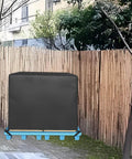 Heavy Duty Water Resistant Pallet Cover With 420D Oxford PU Coated Fabric covering a pallet outdoors against a fence.
