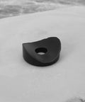 100 Pieces Black Plastic Curved Washers Set For Round Tubes M6 And M8 With PE Spacer Sleeves, single washer close-up view.