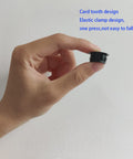 Hand holding a black plastic hole plug, 12 Pack Black Plastic Hole Plugs For Cabinet And Screw Holes, 25mm Size Fits 24.5 To 25mm Openings