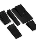 16 Pack Multiple Size Slopes Black Plastic Composite Shims Leveling Wedges For Furniture Displayed on White Surface
