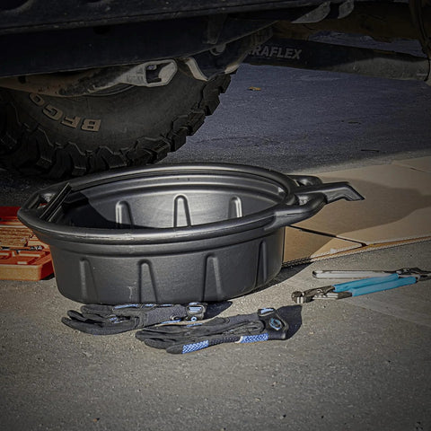 Oil Drain Pan 2 Gallon Capacity Black Plastic Anti Splash Lip Drip Catcher For Motor Oil Gasoline And Antifreeze shown under vehicle
