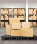 Heavy Duty Black Plastic Pallets 8 Pack Nestable HDPE Floor Pallets For Basement Storage And Shop Warehouse Garage Use Waterproof Anti Static Dust Resistant Lightweight Durable Pallets With Breathable Grid Surfaces holding cardboard boxes in a warehouse.