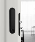 Privacy Door Lock Set With Hidden Pull And Recessed Latch visible on a wooden door, circular black finish, smooth operation.